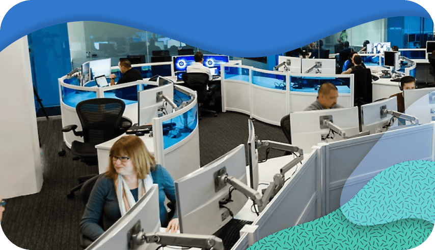 Employees working on computers in an open office setting