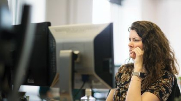 Woman working on desktop computer