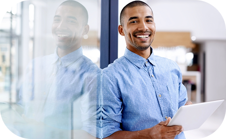 Person smiling and holding a tablet.