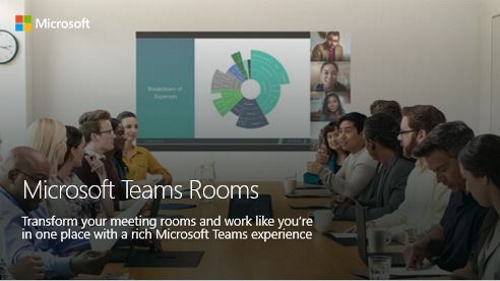 Group of people in conference room with screen