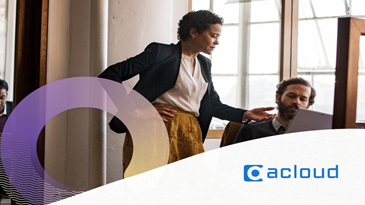 Two people looking at a computer screen.