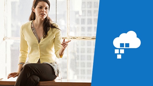 Woman sitting on window sill talking to colleagues