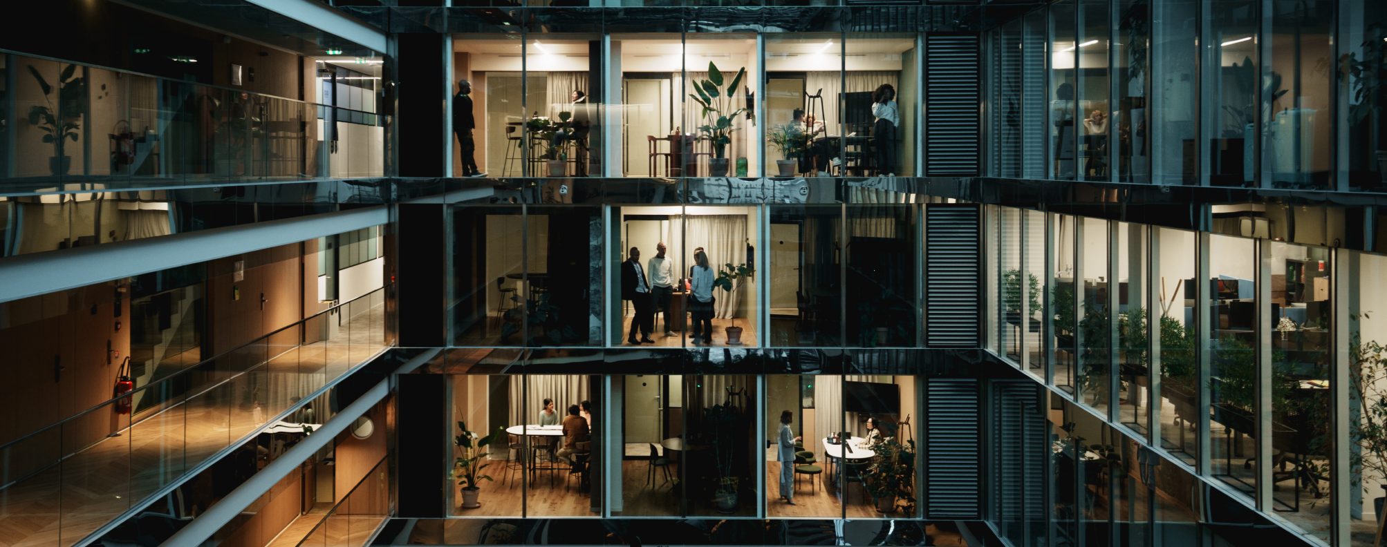 view of conference rooms across atrium of modern office building