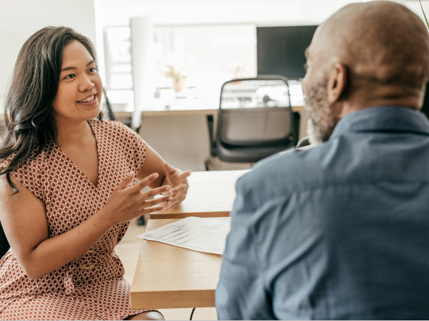 Two people in an office having a discussion