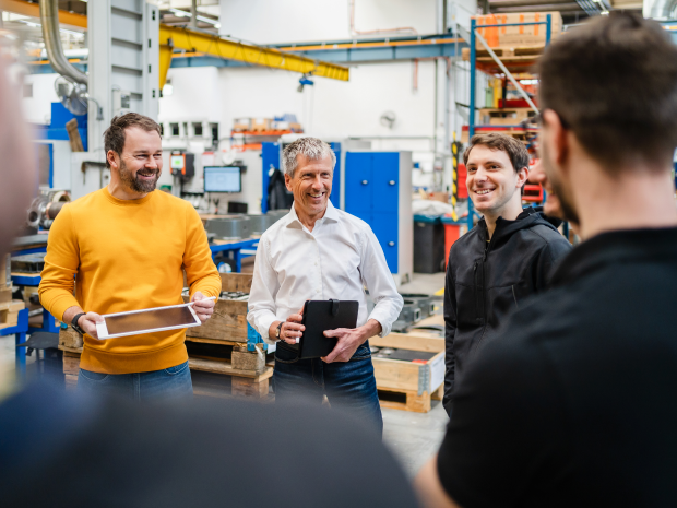 Technology workers in a cutting-edge manufacturing facility