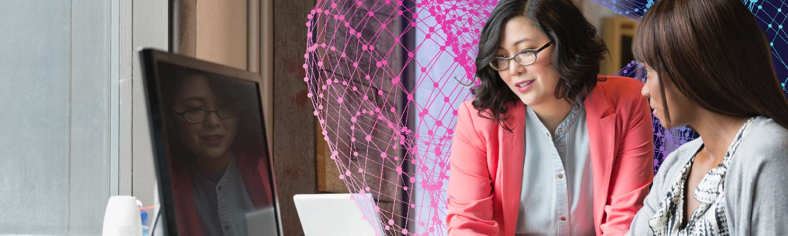 Two women collaborating with overlaid cloud networking graphics