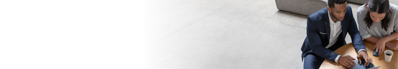 Colleagues working and having coffee