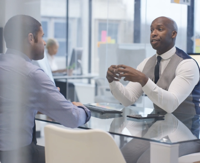 Two colleagues having a chat in an office