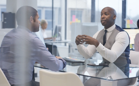 Two colleagues having a chat in an office