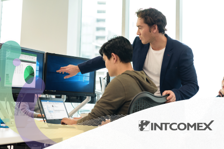 Two men collaborating at a desk in a modern office.