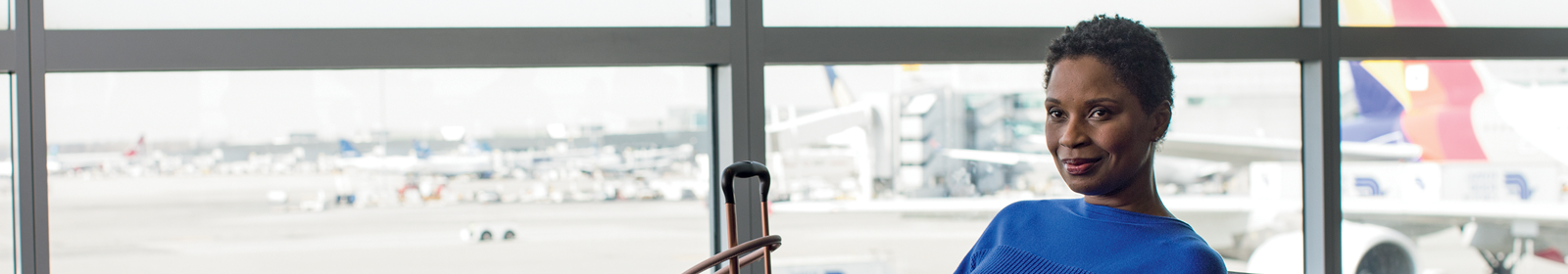A woman sitting in an airport terminal