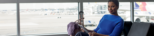 A woman sitting in an airport terminal