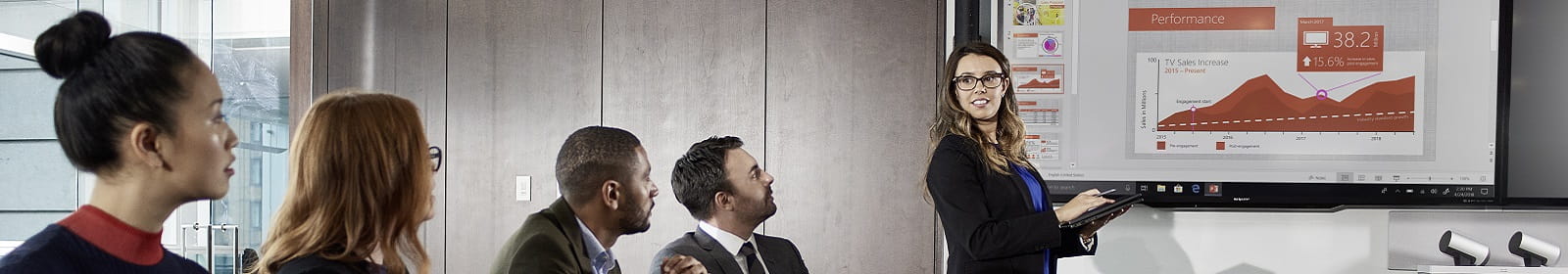 People listen during a meeting in a conference room