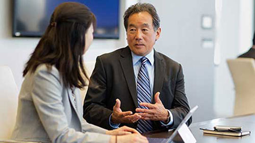 Man and woman coworkers having a discussion