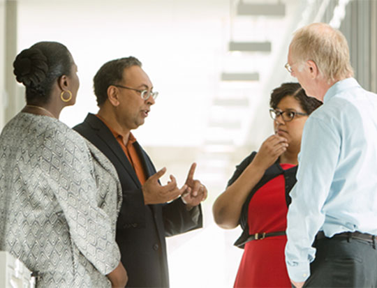 Four people having a discussion
