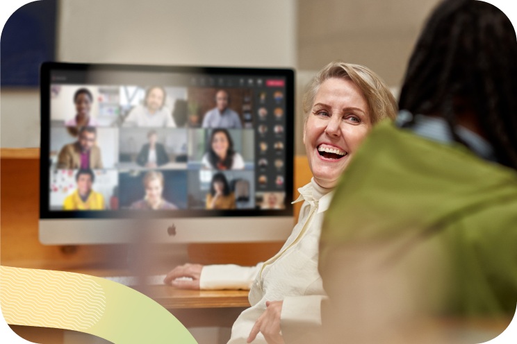 A person laughing while on a video call