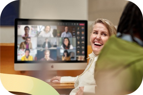 A person laughing while on a video call