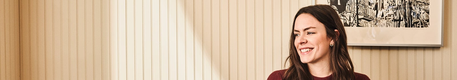 A woman smiles while working