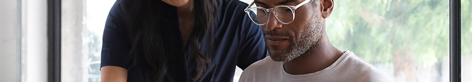 A student is being taught how to use a new system