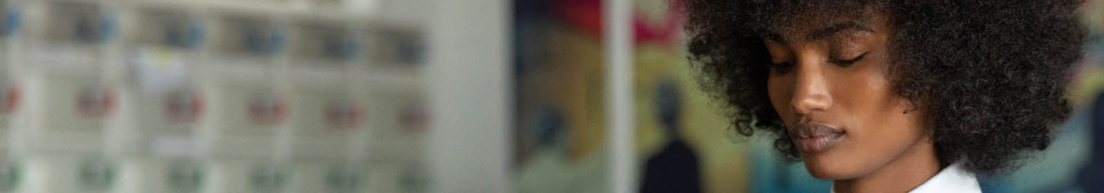 A woman working on a tablet in an office