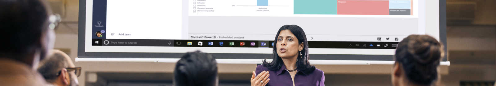 Business leader using data in her presentation