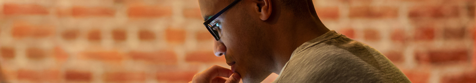 Colleagues working on laptops in a cafe