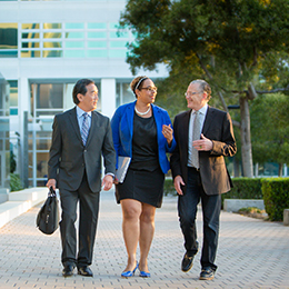 Coworkers having a discussion in courtyard