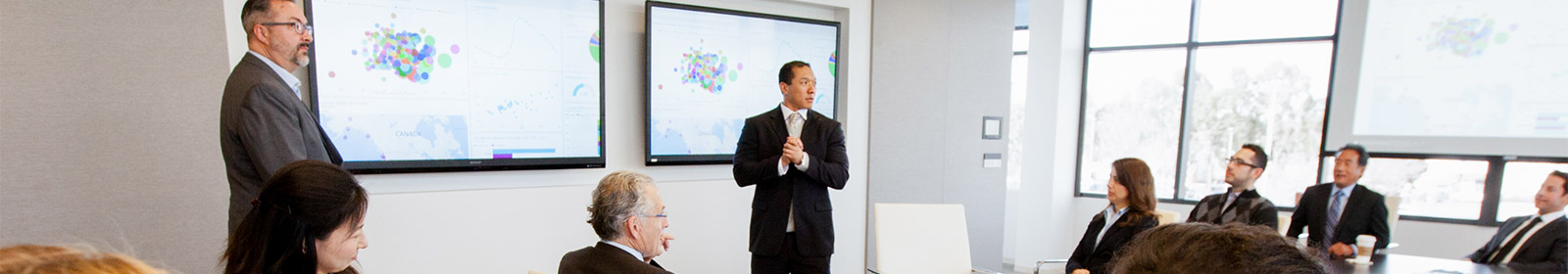 Two men presenting during a meeting