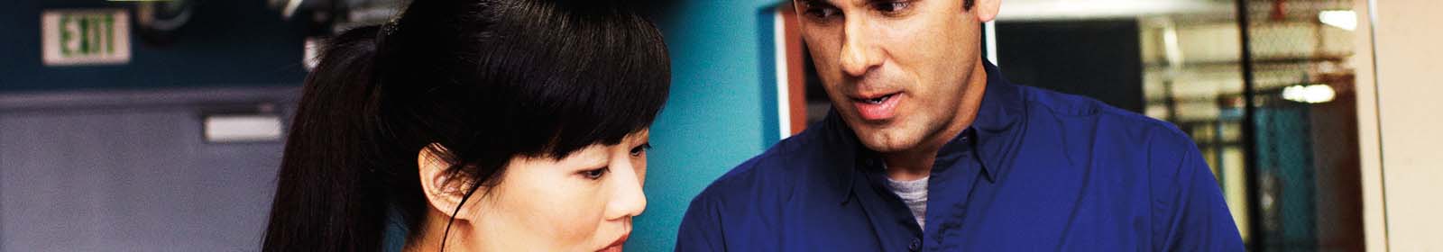 Man and woman looking at a tablet