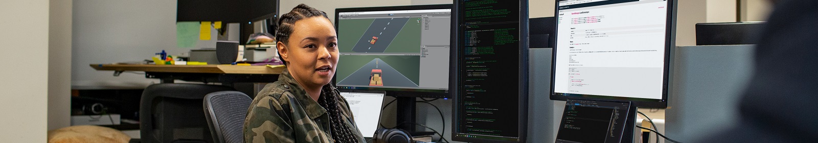 A developer turns to talk to their coworker