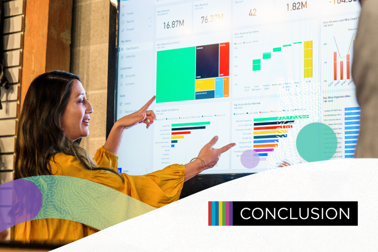 A person reviewing data charts being projected on a screen.