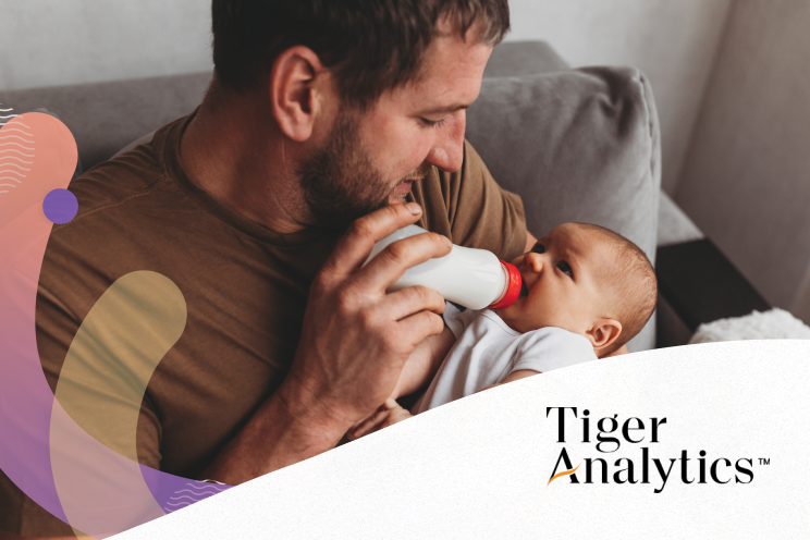 A person feeding a baby with a bottle.