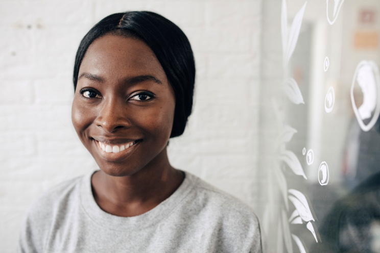 A person smiling at the camera.