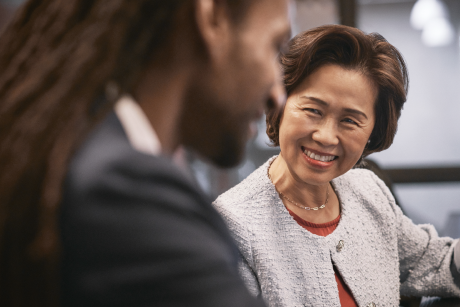 Person smiling at another person.