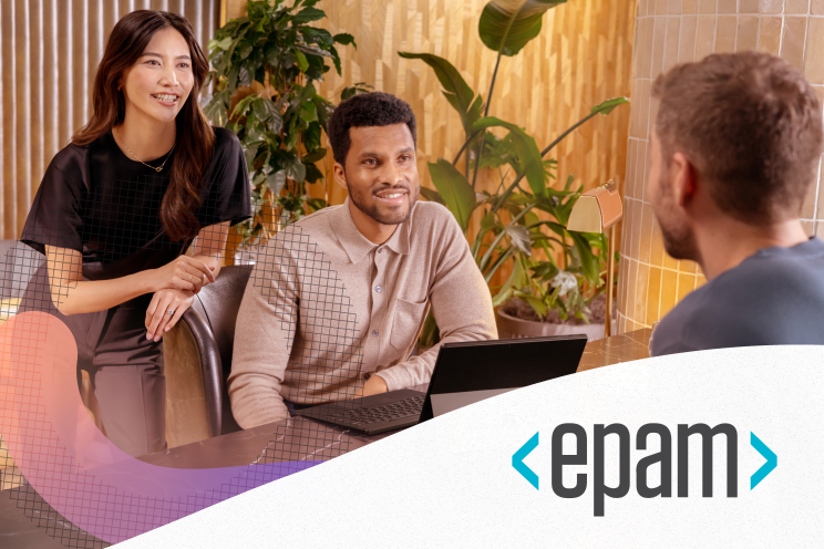 Two people listening to a third person.