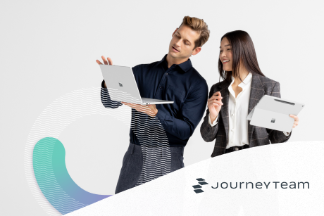 Two people looking at a laptop.