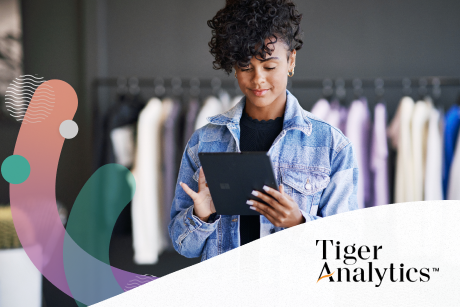 Person in a clothing retail store working on a tablet.