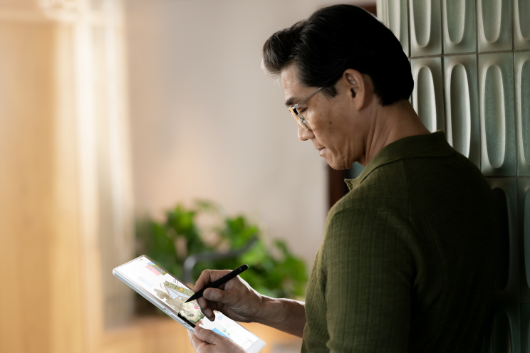 A person reviewing information on a tablet computer.