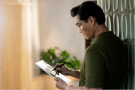A person reviewing information on a tablet computer.