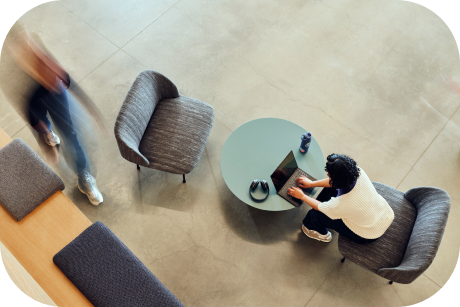 Overhead view of a person working on a laptop.