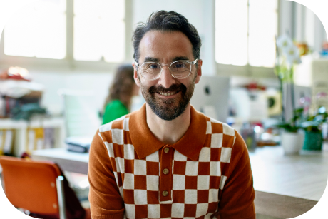 A person smiling in a casual setting.