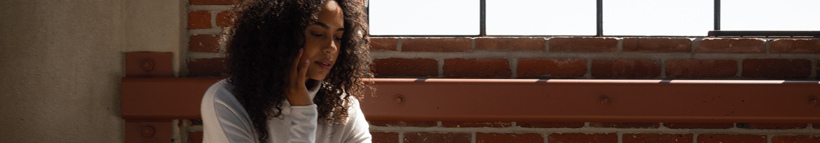 A tech industry employee walks down a hallway