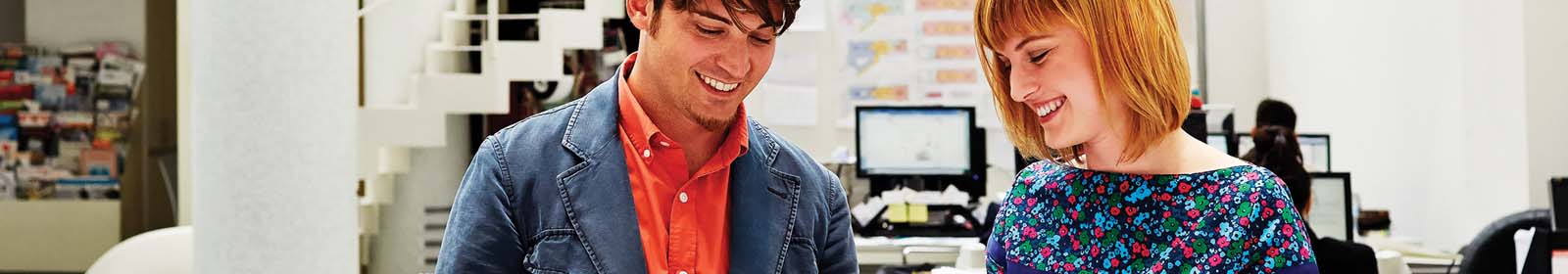 Man and woman smiling together.