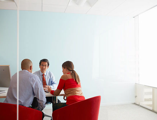 Man talking with two clients