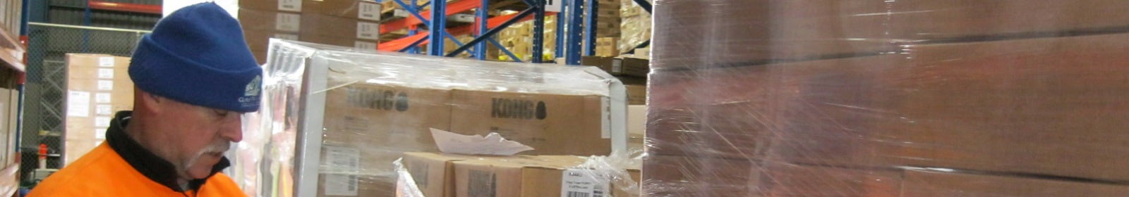 A KONG employee works in a warehouse