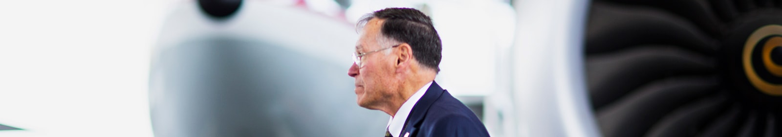 Man walking in front of airplane