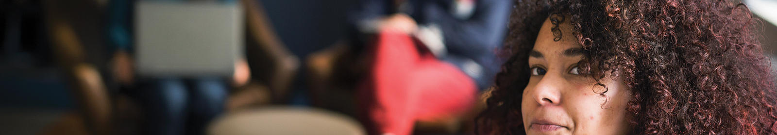 A woman watches a presentation