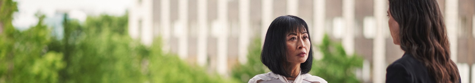 Two women discuss a project