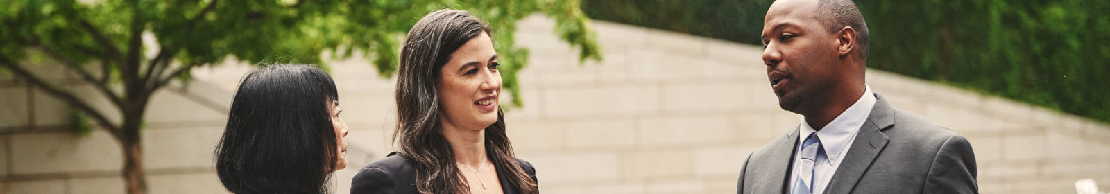 A group discusses work outside