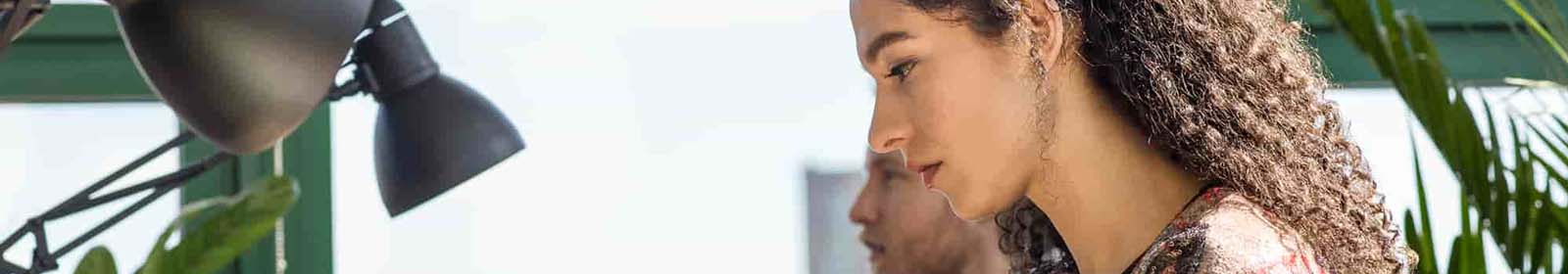 Close-up of male and female colleagues working